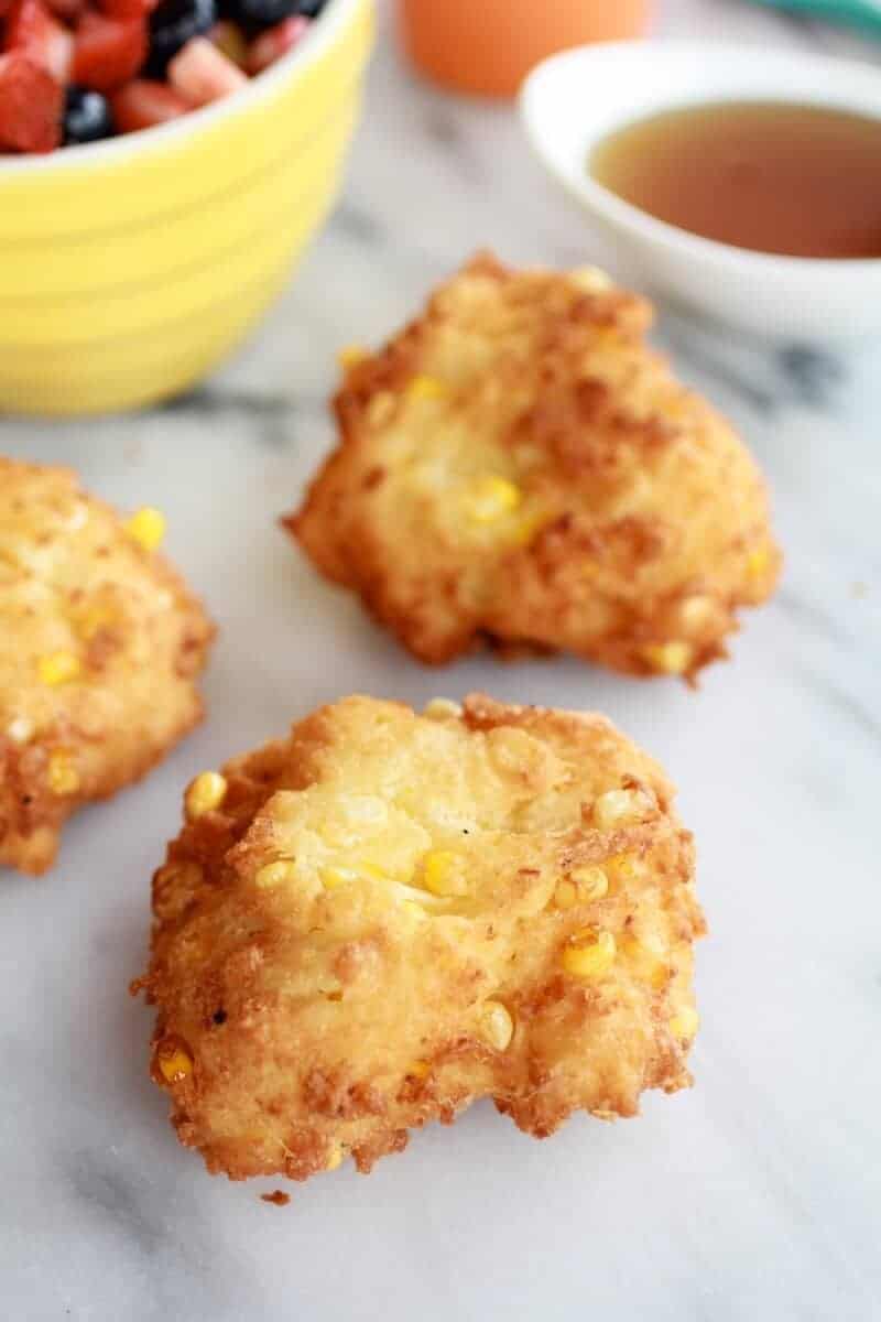 Corn Fritters with Coconut Whipped Cream and Sweet Honey Bourbon Syrup | https://www.halfbakedharvest.com/