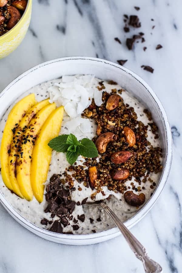 Coconut Banana Oats Smoothie Bowl with Crunchy Black Sesame Quinoa Cereal + Mango | halfbakedharvest.com