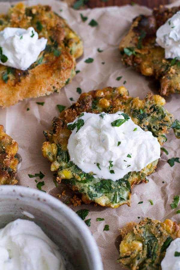 Spinach and Artichoke Corn Fritters with Brie and Sweet Honey Jalapeño Cream | halfbakedharvest.com