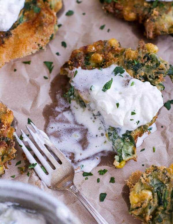 Spinach and Artichoke Corn Fritters with Brie and Sweet Honey Jalapeño Cream | halfbakedharvest.com
