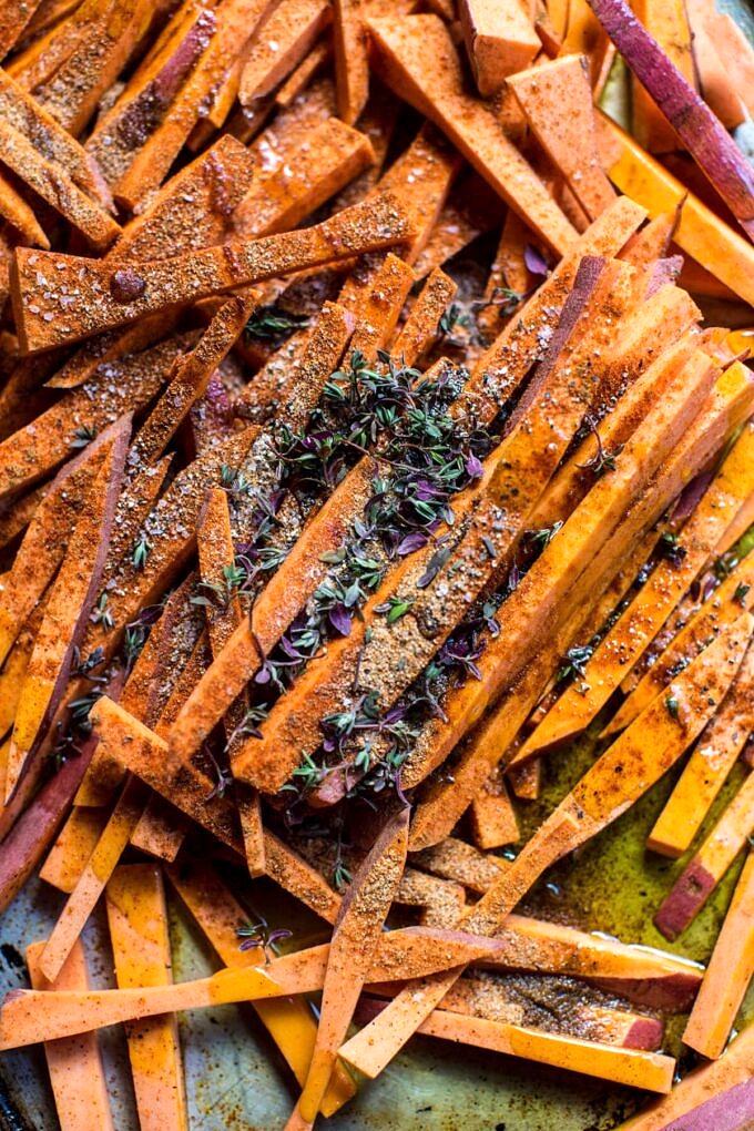 Skinny Cajun Sweet Potato Fries with Garlic Cheese Sauce. Half Baked