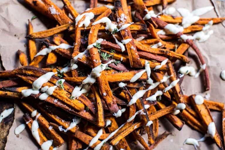 Skinny Cajun Sweet Potato Fries with Garlic Cheese Sauce. Half Baked