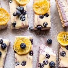 Blueberry Lemon Cheesecake Bars with Candied Lemon | halfbakedharvest.com #spring #easter #cheesecake #dessert