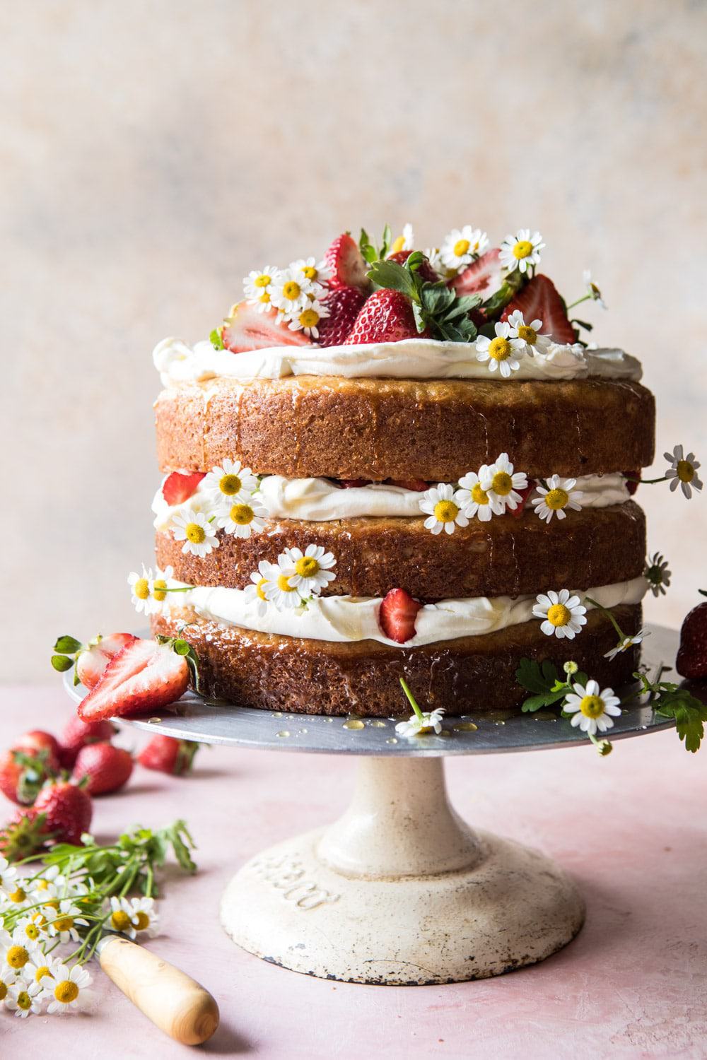 A spectacular strawberries and cream naked layer cake that 