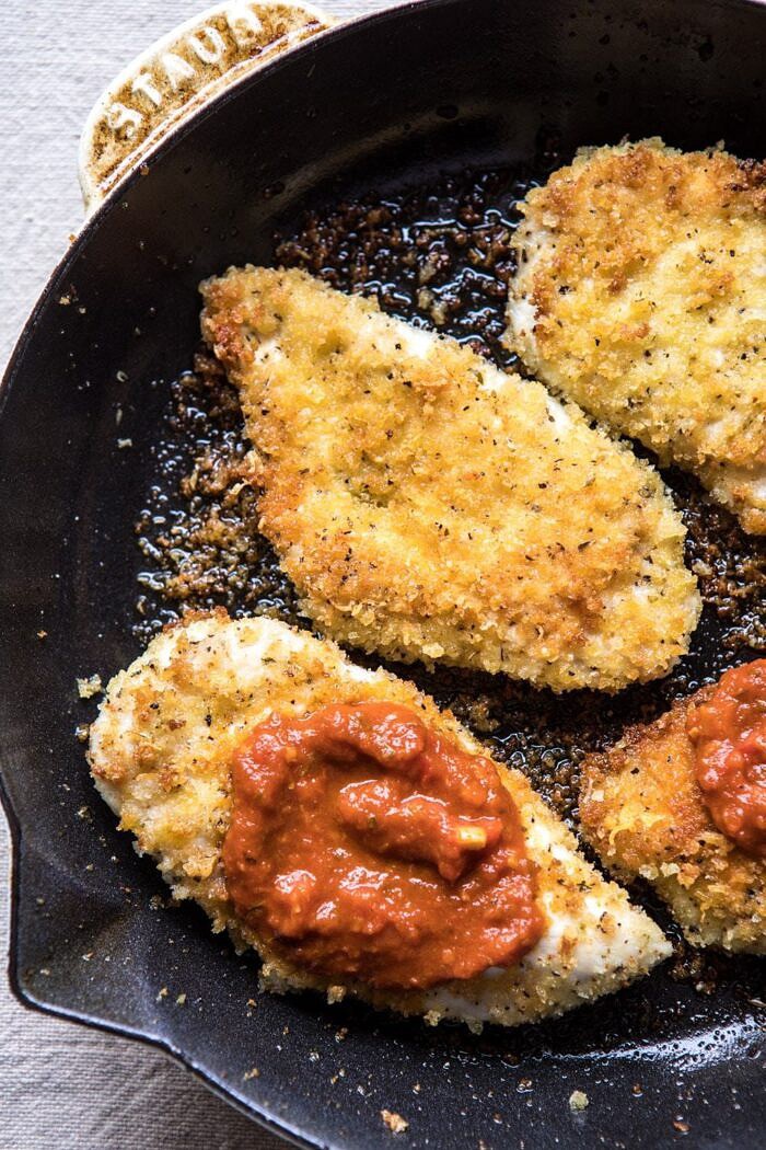 photo of Spring Chicken Parmesan in skillet with tomato sauce