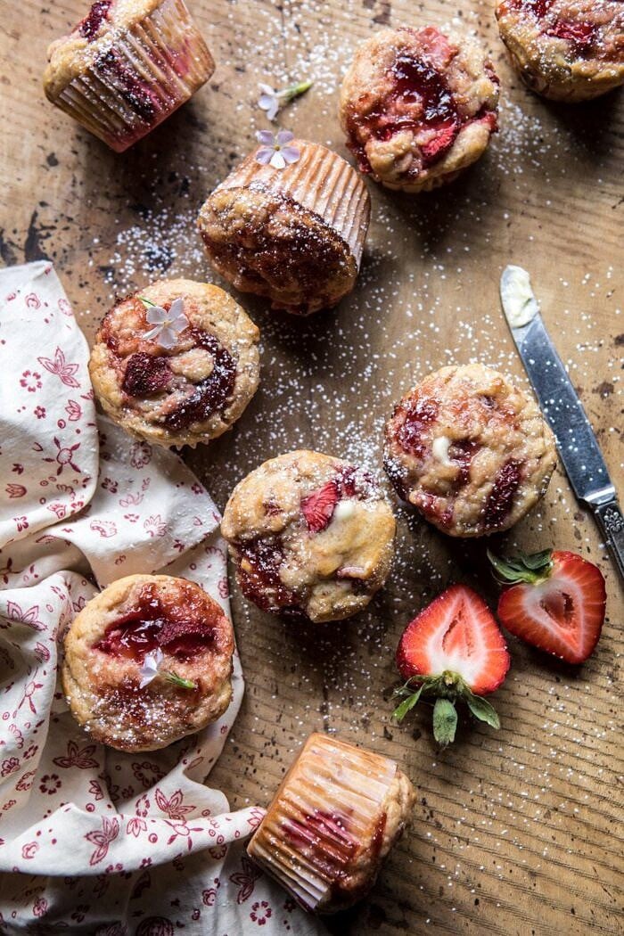 overhead photo of Honey Strawberry Muffins with butter knife
