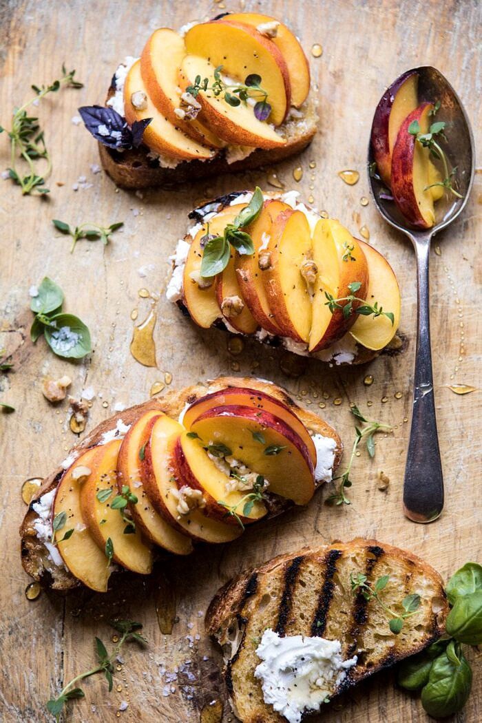 overhead photo of Thyme, Honey, Peach, and Goat Cheese Crostini with spoon