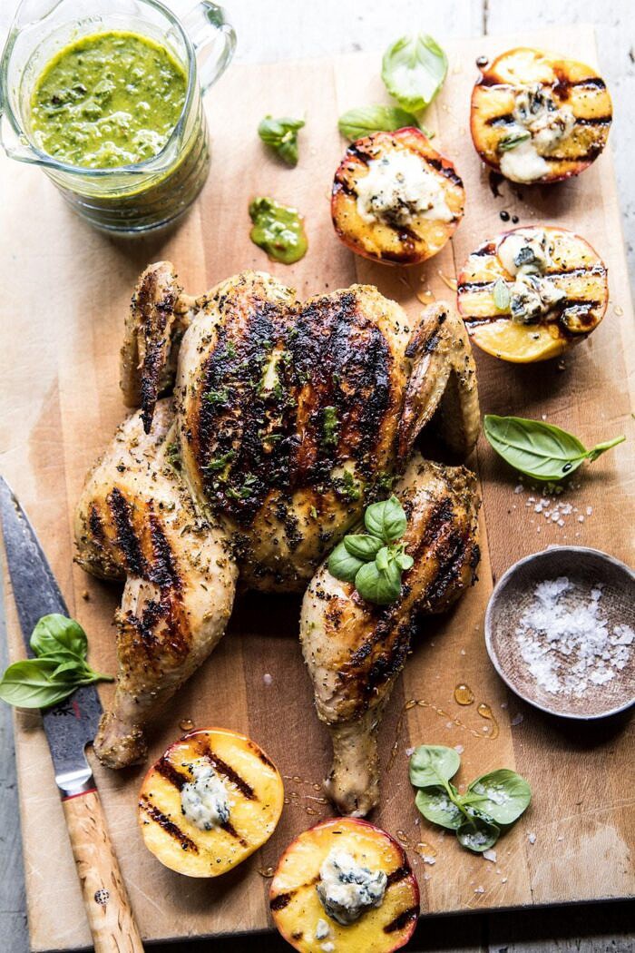 overhead photo of Whole Grilled Chicken with Peaches and Basil Vinaigrette on cutting board