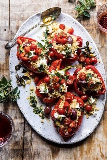 Greek Orzo Stuffed Red Peppers with Lemony Basil Tomatoes | halfbakedharvest.com #healthy #summerrecipes #easy #dinner #greek