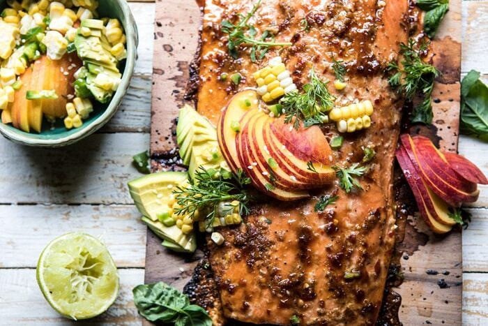 horizontal photo of Honey Ginger Cedar Plank Grilled Salmon with Avocado Salsa