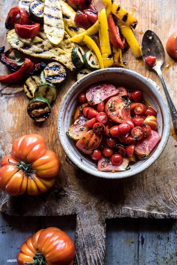 overhead photo of Marinated Tomatoes and Grilled Vegetables on cutting board