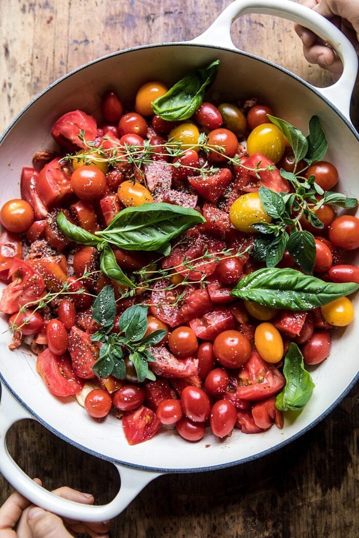 overhead photo of raw tomatoes in skillet