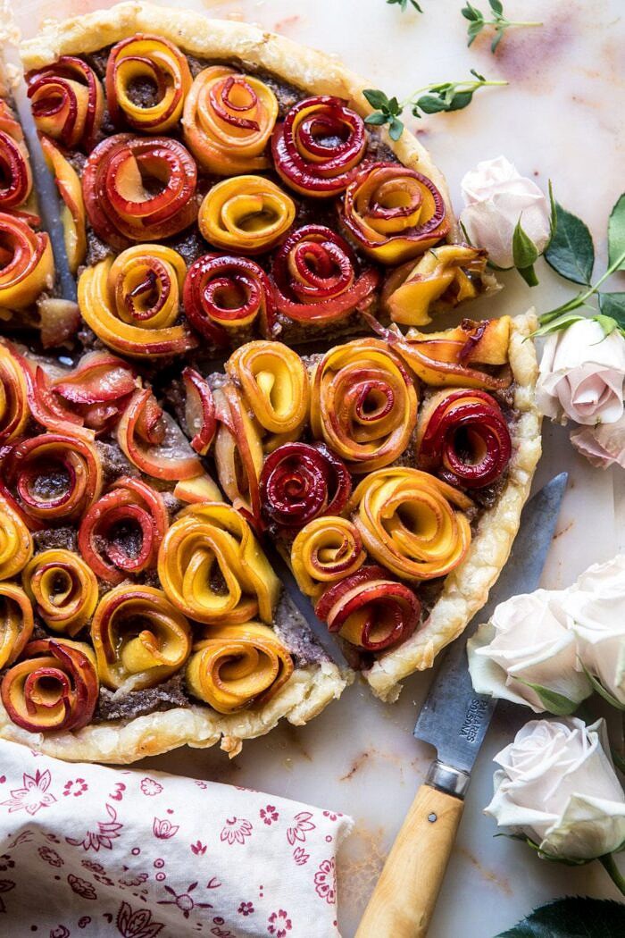 overhead photo of Sweet Peach Rose Tart with 4 pieces cut into triangles 