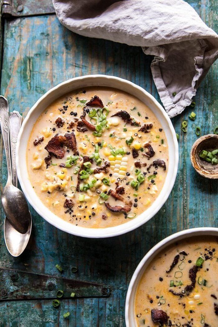 overhead photo Instant Pot Chipotle Cheddar Corn Chowder in bowls with spoons next to bowls