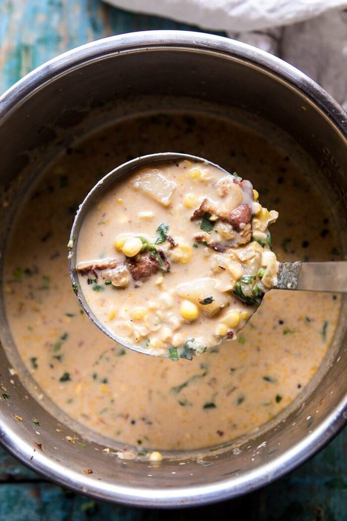 Instant Pot Chipotle Cheddar Corn Chowder in instant pot bowl with soup ladle 