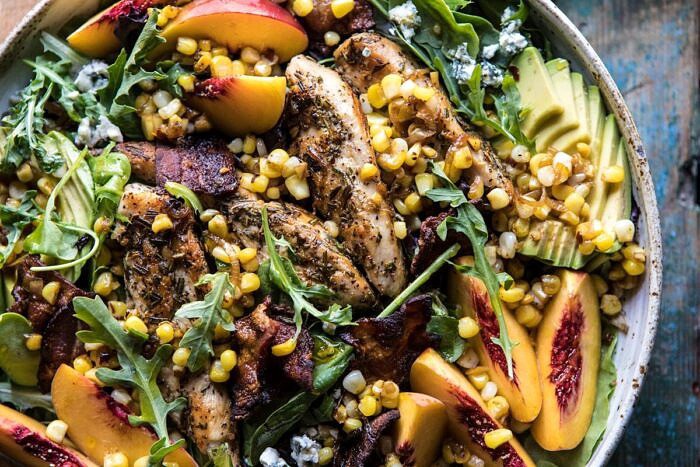 horizontal photo of Rosemary Chicken, Caramelized Corn, and Peach Salad with Hot Bacon Vinaigrette