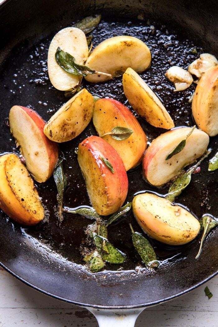 apples in skillet with sage 
