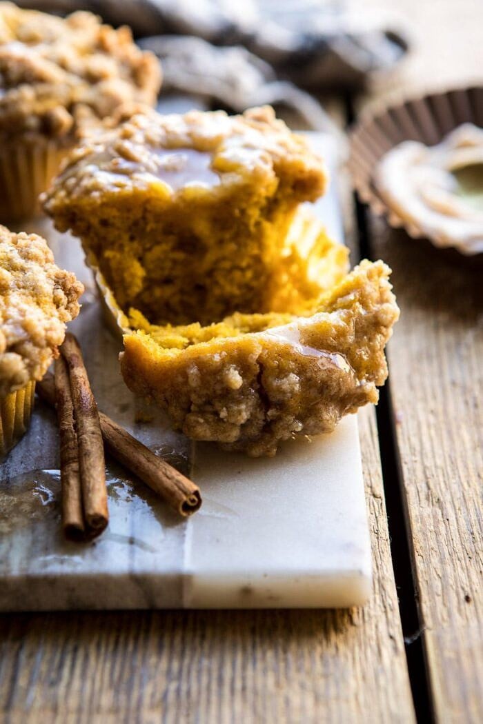 close up pf cut in half Pumpkin Coffee Cake Muffins with Cinnamon Honey Butter 