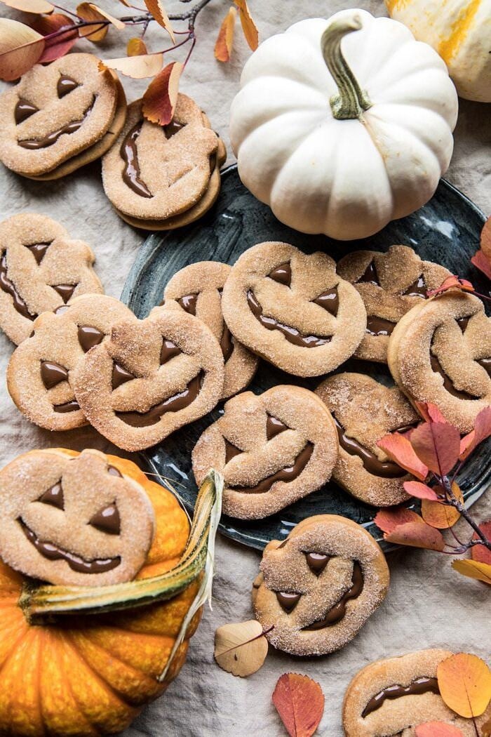 Milk Chocolate Stuffed Jack-O'-Lantern Cookies | halfbakedharvest.com #halloween #thanksgiving #cookies #easyrecipes #chocolate #holidayrecipes #fallrecipes
