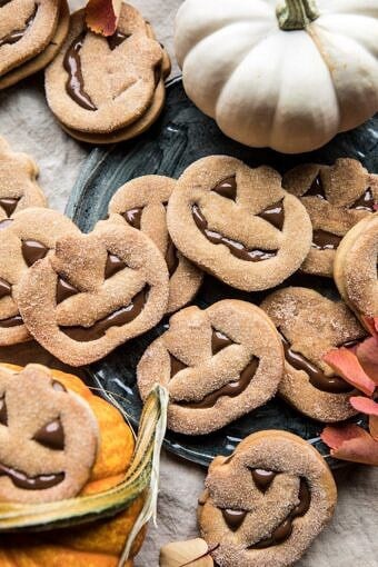 Milk Chocolate Stuffed Jack-O'-Lantern Cookies | halfbakedharvest.com #halloween #thanksgiving #cookies #easyrecipes #chocolate #holidayrecipes #fallrecipes