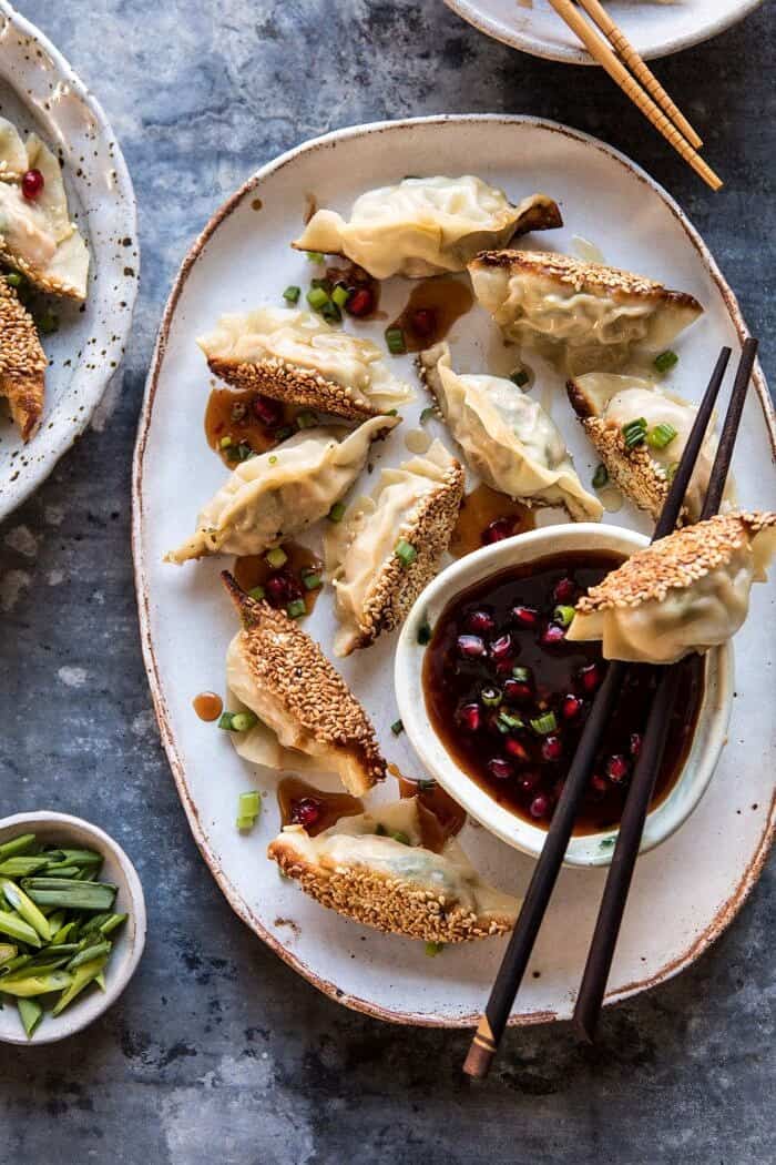 overhead photo of Ginger Sesame Chicken Potstickers with Sweet Chili Pomegranate Sauce 
