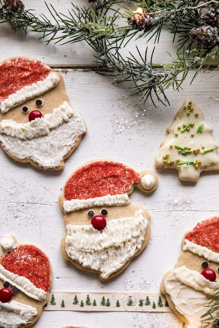 overhead close up photo of Chai Spiced Santa Cookies with White Chocolate Frosting