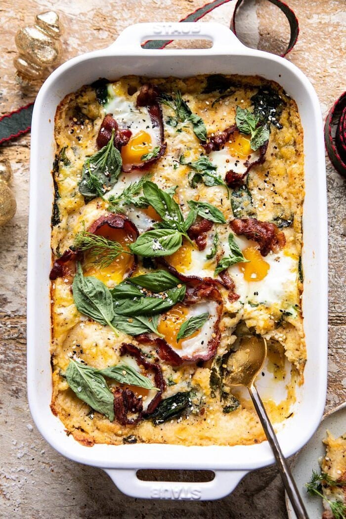 overhead photo of Everything Cheesy Potato and Egg Breakfast Casserole with spoon in dish