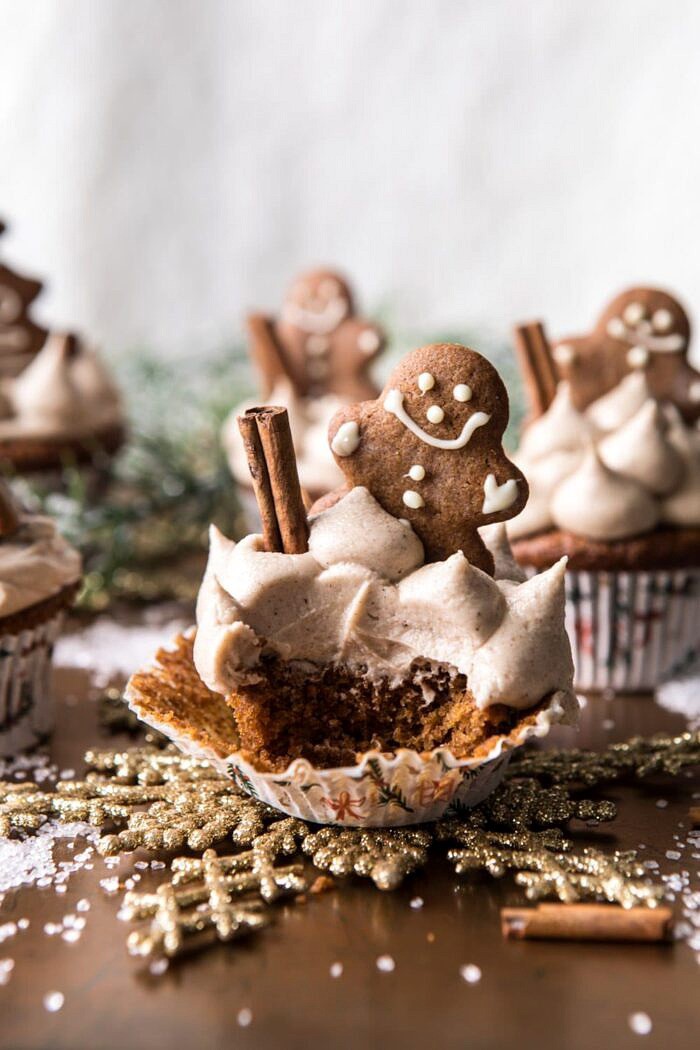 side angle photo of Gingerbread Cupcakes with Cinnamon Browned Butter Buttercream with bite take out of cupcake