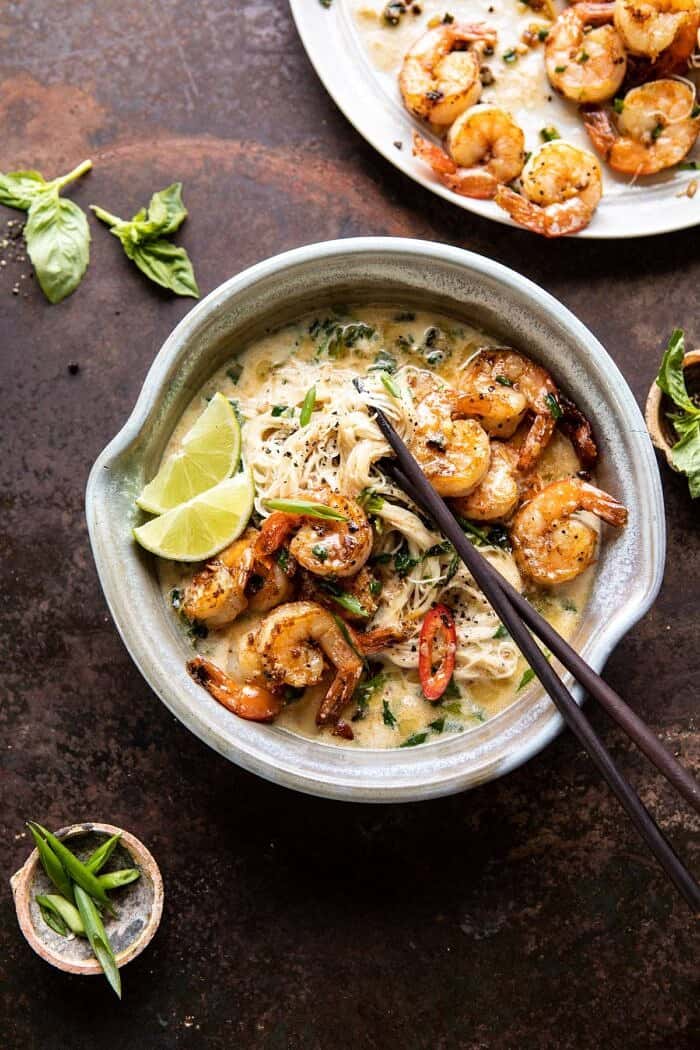 overhead photo of Saucy Garlic Butter Shrimp with Coconut Milk and Rice Noodles with chopsticks in bowl