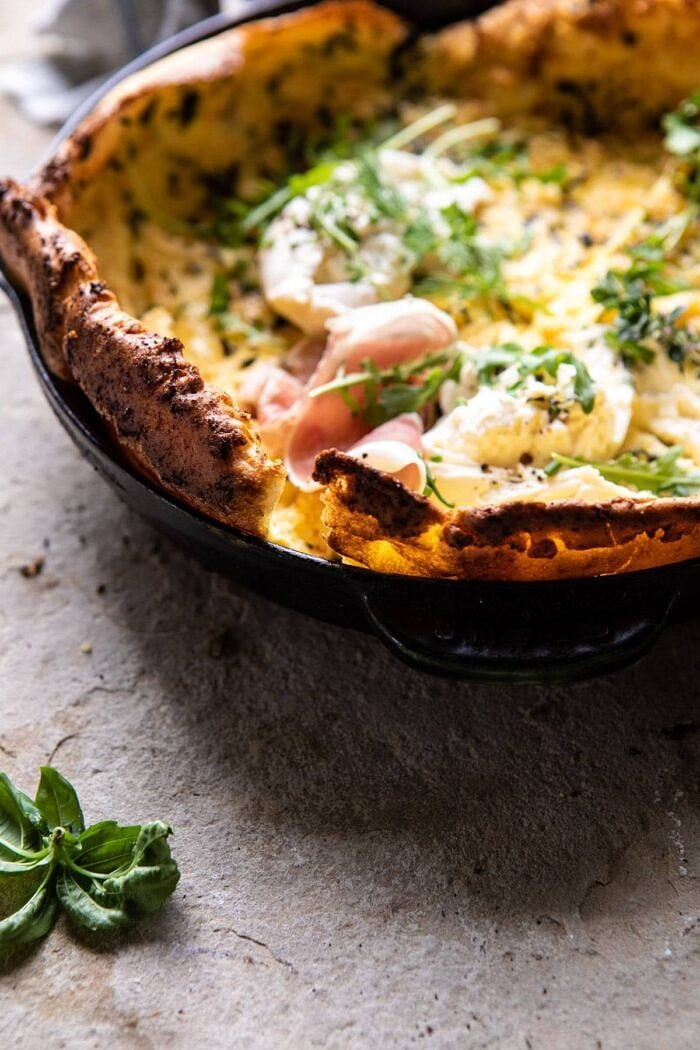 side angled photo of Savory Herb Butter Dutch Baby in skillet