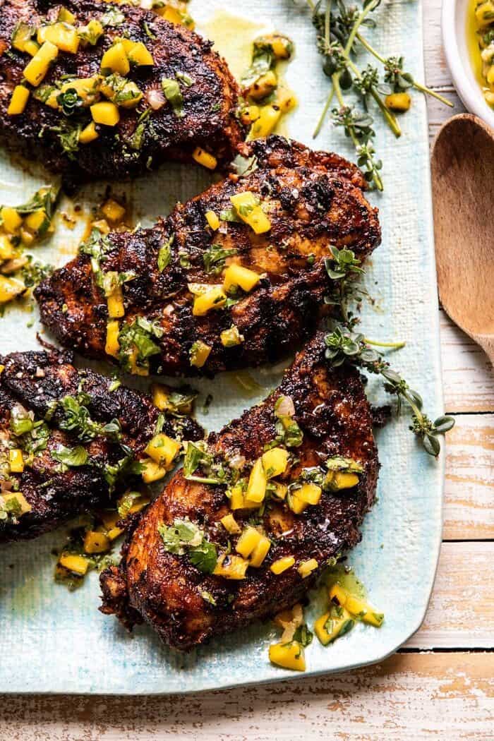 overhead close up photo of Tropical Jerk Grilled Chicken with Charred Mango Salsa Verde 
