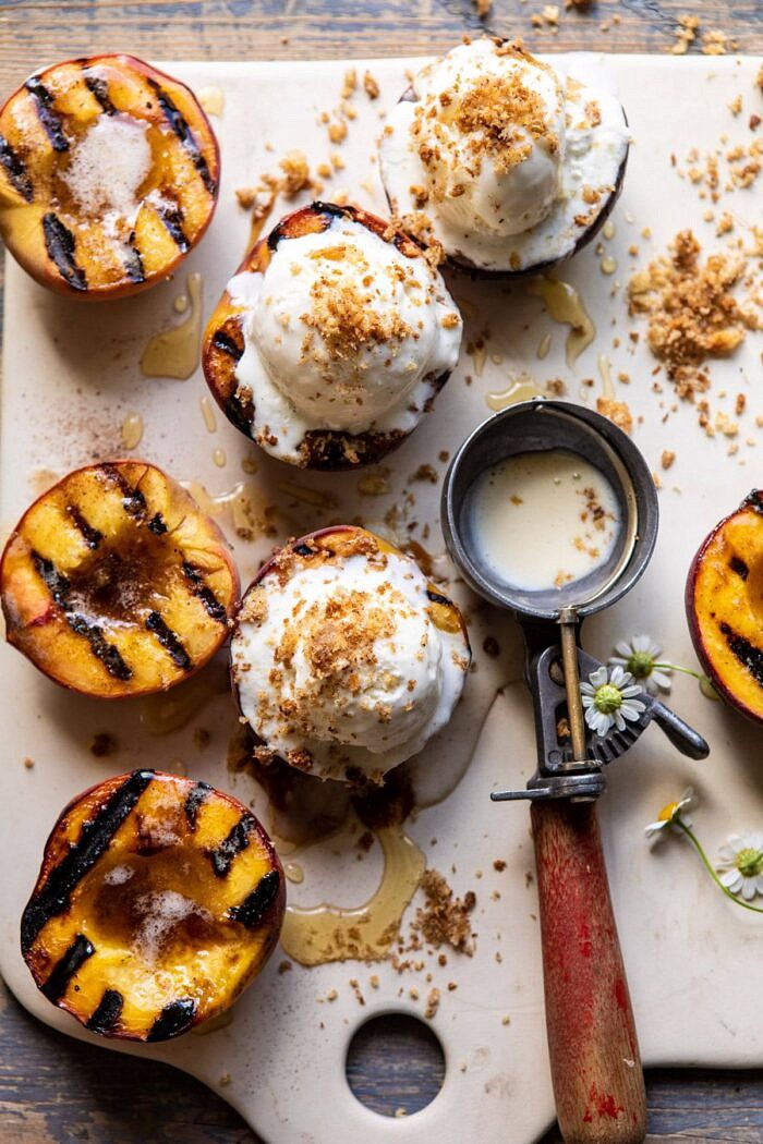 overhead close up photo of Browned Butter Grilled Peaches with Cinnamon Toast Brioche Crumbs on serving plate