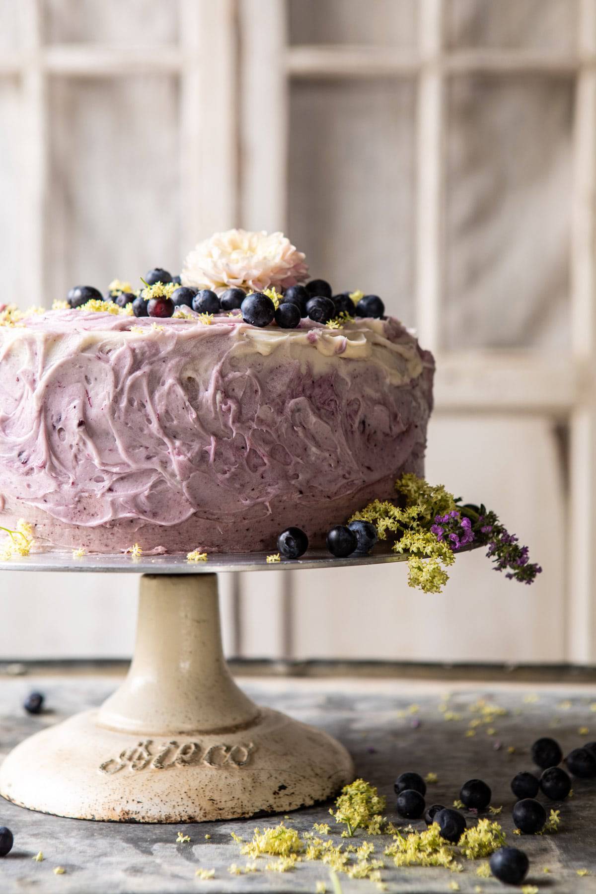 Bursting Blueberry Lemon Layer Cake | halfbakedharvest.com #bleberrycake #layercake #summerrecipes #dessert
