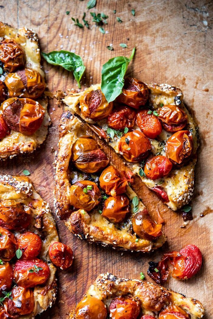 overhead close up photo of single Caramelized Onion and Balsamic Tomato Tart cut in half