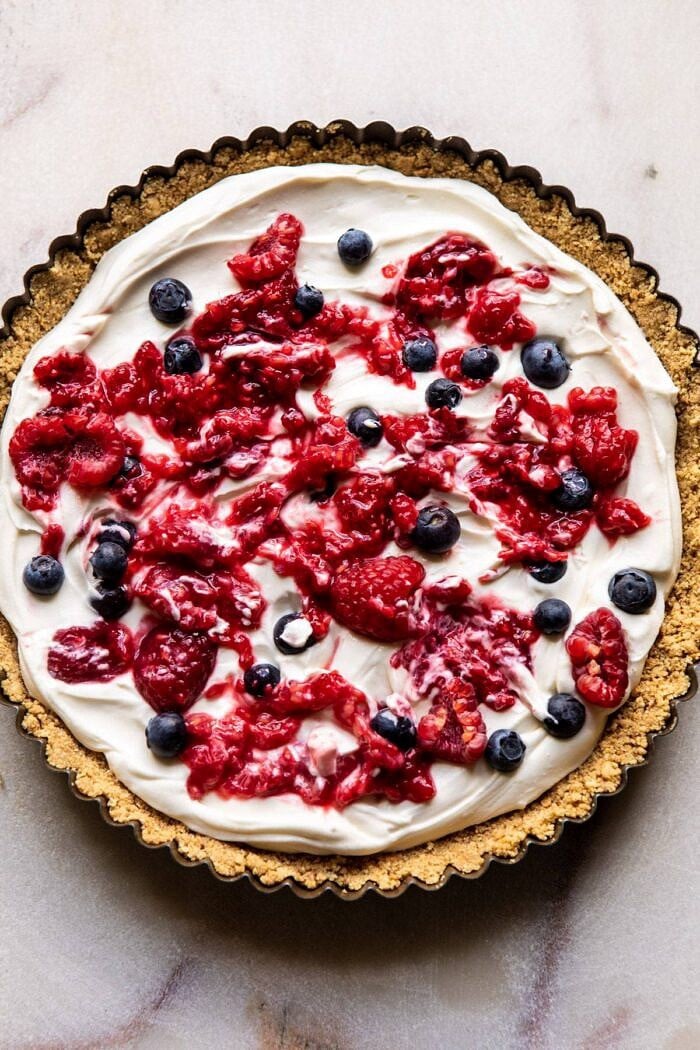 overhead photo of No-Bake Eton Mess Berry Cheesecake before chilling and adding toppings