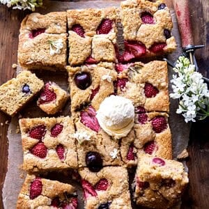 Cherry Strawberry Streusel Cake | halfbakedharvest.com #easyrecipes #cake #sheetcake #summerdessert
