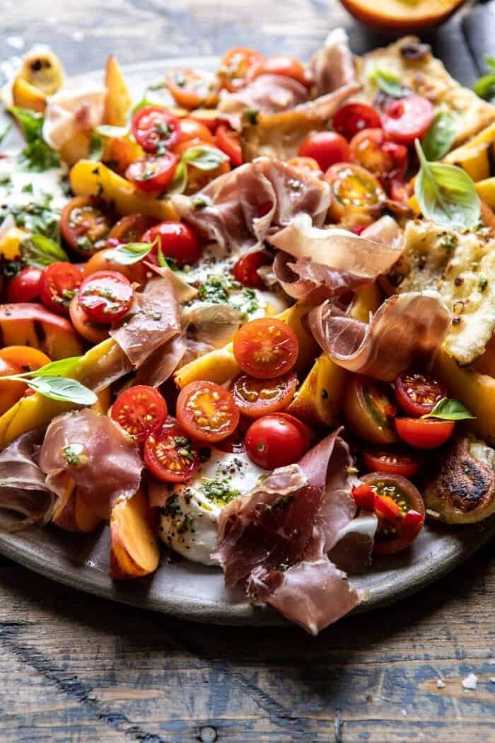 side angled photo of Peach Caprese Salad with Toasted Garlic Naan