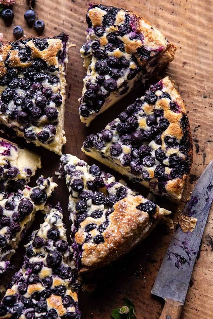 overhead close up photo of Simple Blueberry Basque Cheesecake with 6 slices cut from cake