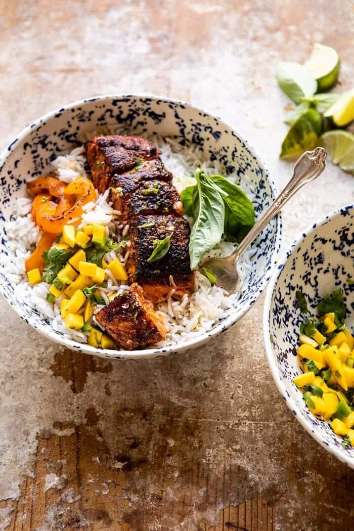 side angled photo of Cilantro Lime Salmon with Mango Salsa with fork in bowl and bite taken out 