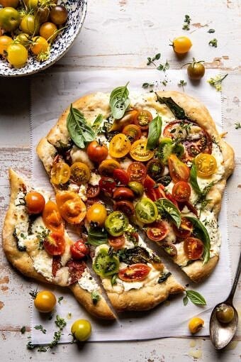 Herbed Butter Heirloom Tomato Pizza | halfbakedharvest.com #pizza #easyrecipe #tomatoes