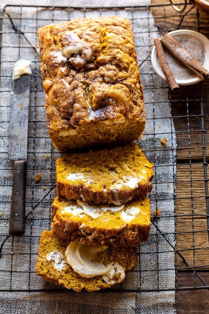 overhead close up photo of Cream Cheese Swirled Pumpkin Bread with 3 slices of bread cut