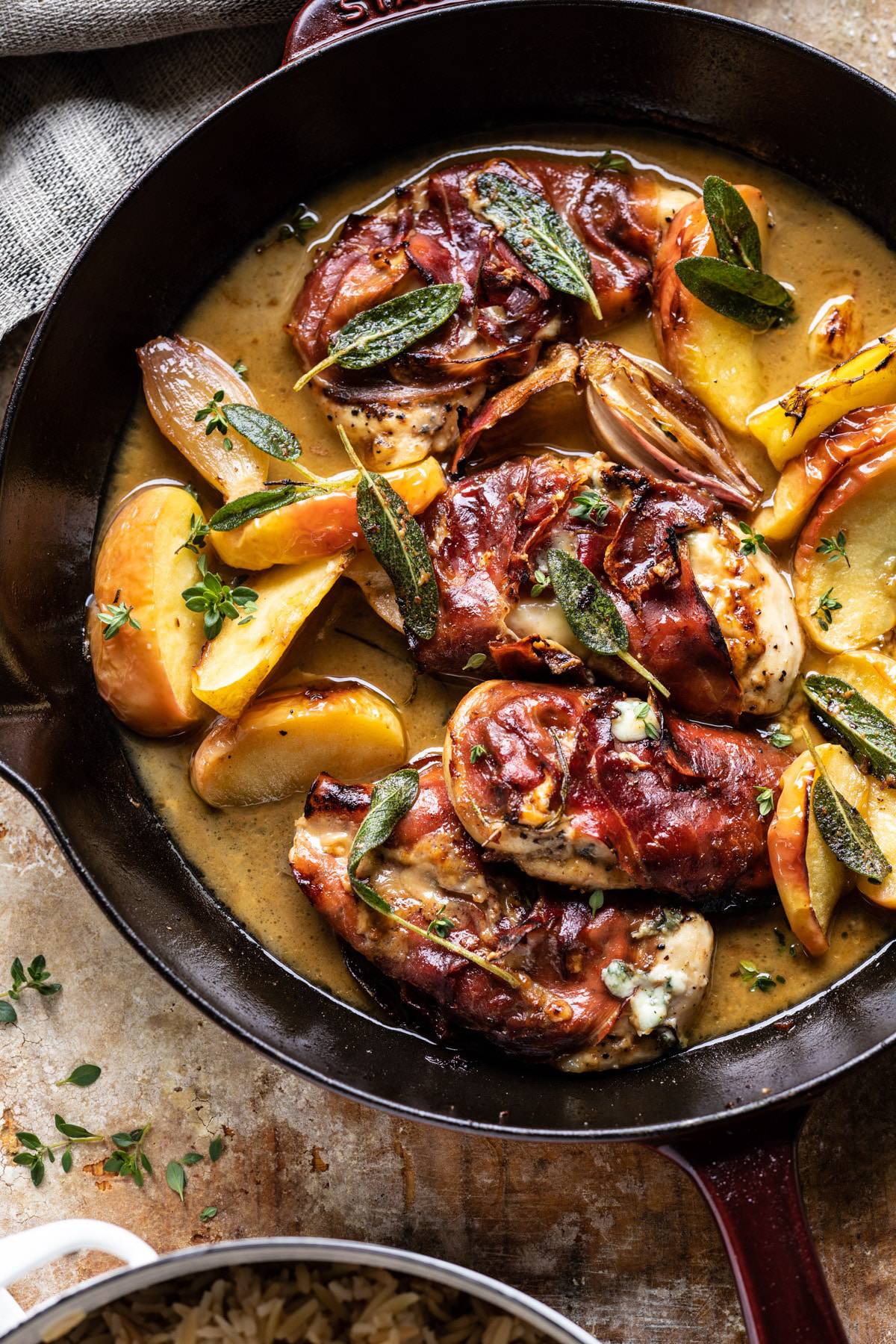 Prosciutto Apple and Sage Butter Chicken with Cider Pan Sauce | halfbakedharvest.com #chicken #apples #fallrecipes #skillet