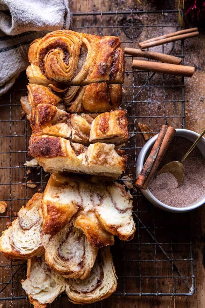 overhead photo of Easy Swirled Cinnamon Sugar Croissant Loaf with multiple slices cut