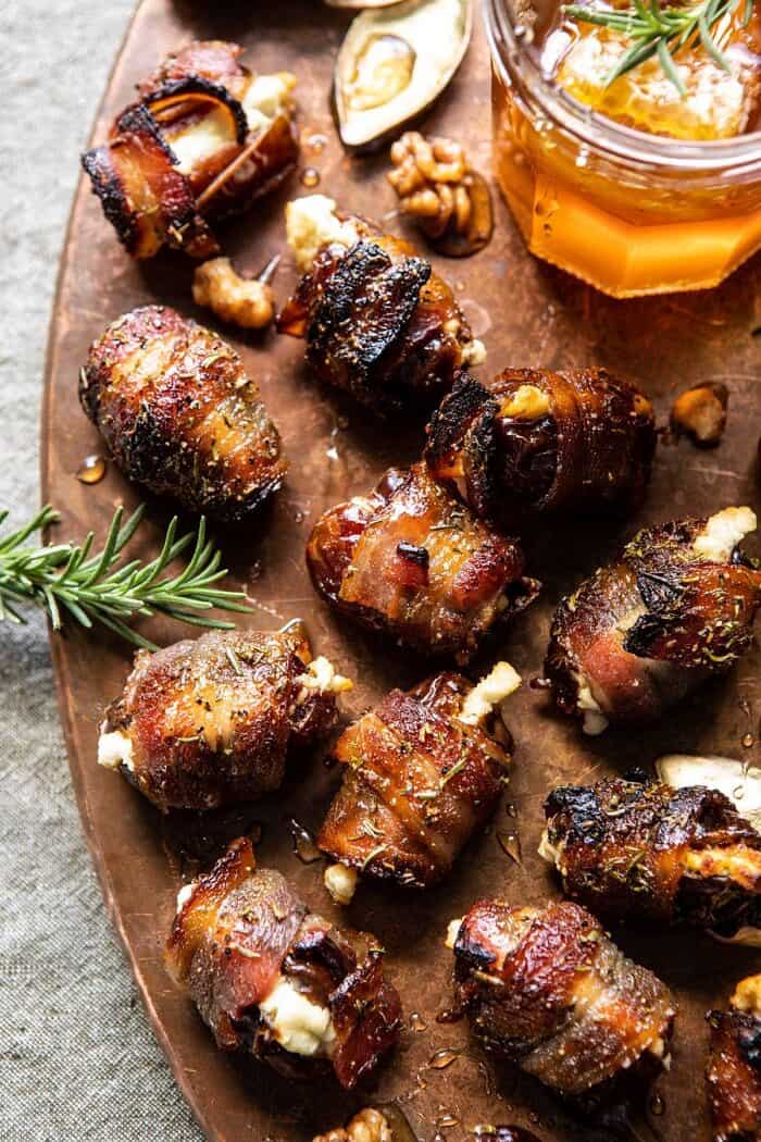 overhead close up photo Goat Cheese Stuffed Bacon Wrapped Dates with Rosemary Honey 