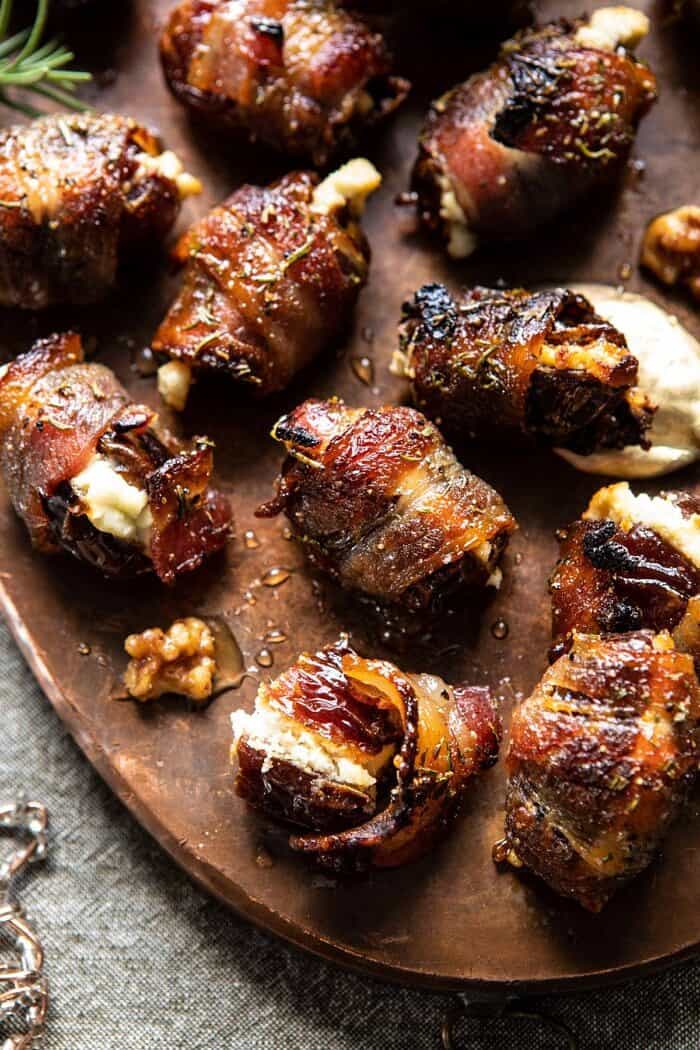 overhead close up photo of Goat Cheese Stuffed Bacon Wrapped Date split in half to expose the goat filling 