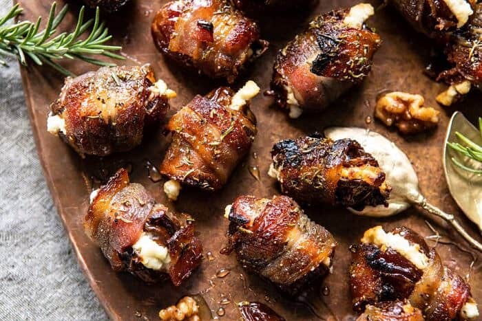 horizontal photo of Goat Cheese Stuffed Bacon Wrapped Dates with Rosemary Honey