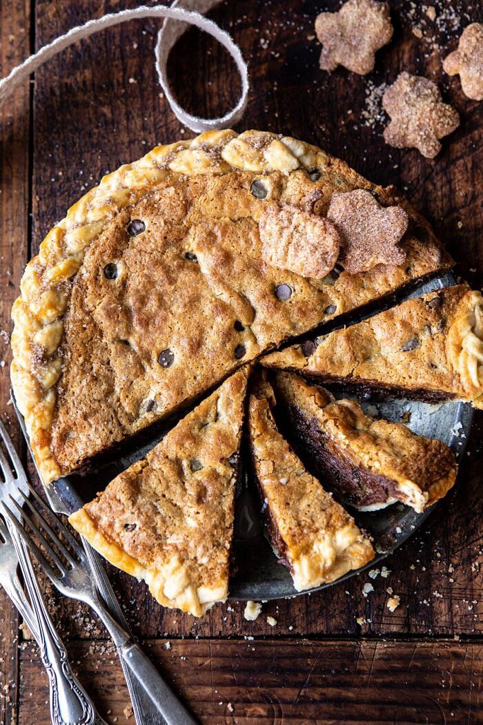 overhead photo of Gooey Chocolate Chip Cookie Pumpkin Pie with pie slices cut