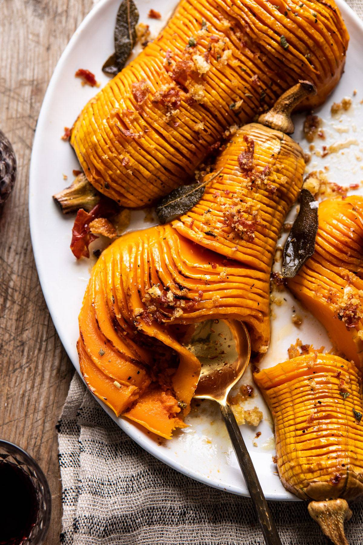 Hasselback Butternut Squash with Sage Butter and Prosciutto Breadcrumbs | halfbakedharvest.com #thanksgiving #sidedishes #butternutsquash