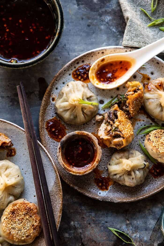 overhead photo of Chinese Mushroom Dumplings with Sweet Chili Ginger Sesame Sauce and the dumplings torn in half
