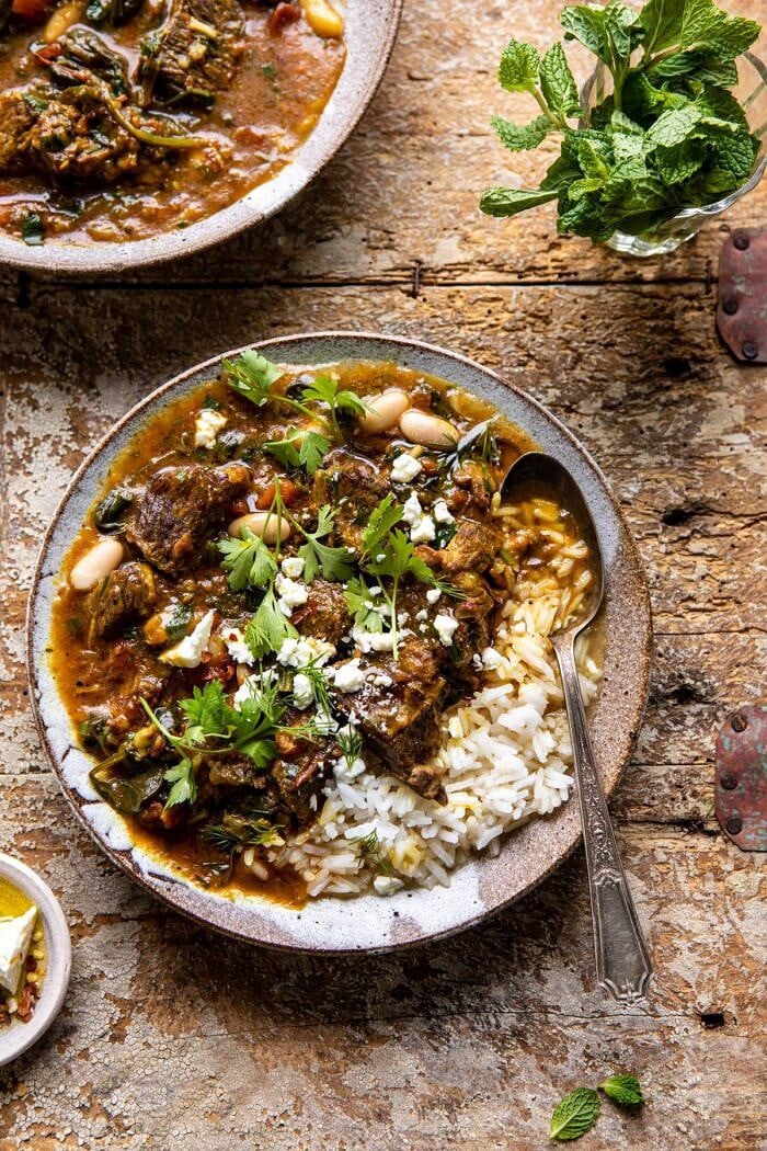 overhead photo of Persian Herb and Beef Stew with spoon in bowl 